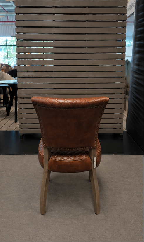 Timothy Oulton MIMI QUILT Chair in Buck'dN Brok'n leather in the showroom
