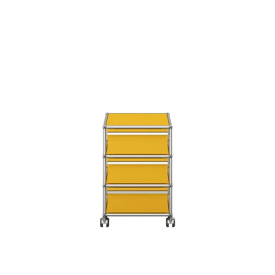Rollcontainer M26 in Goldgelb von USM Haller – leuchtender Farbpunkt für kreative Büroräume und inspirierende Arbeitsplatzgestaltung