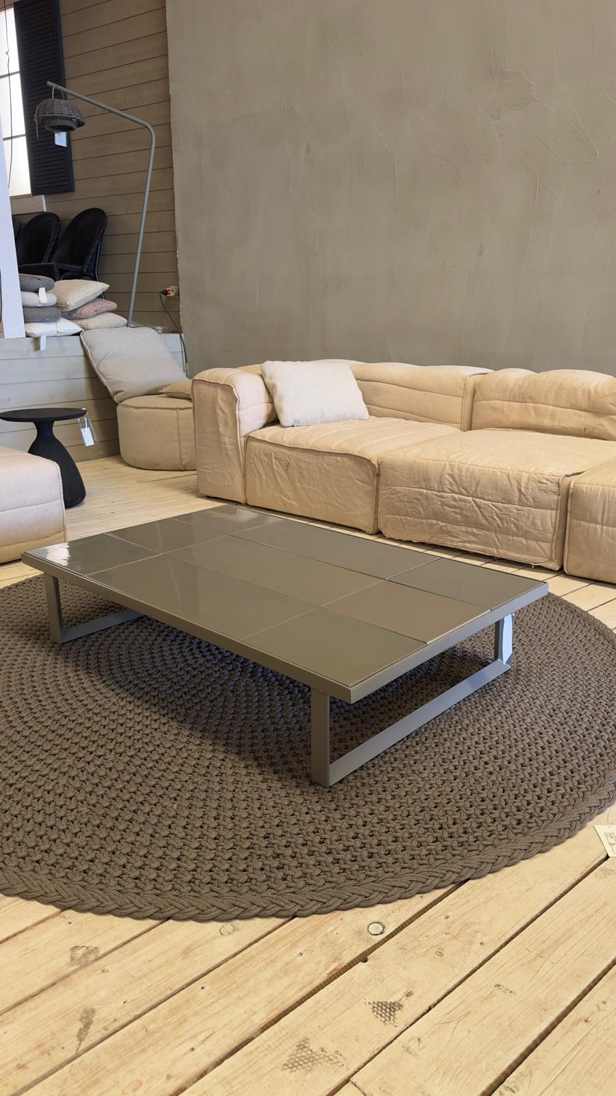 Cane-line GLAZE Coffee Table with a glazed lava stone tabletop in taupe