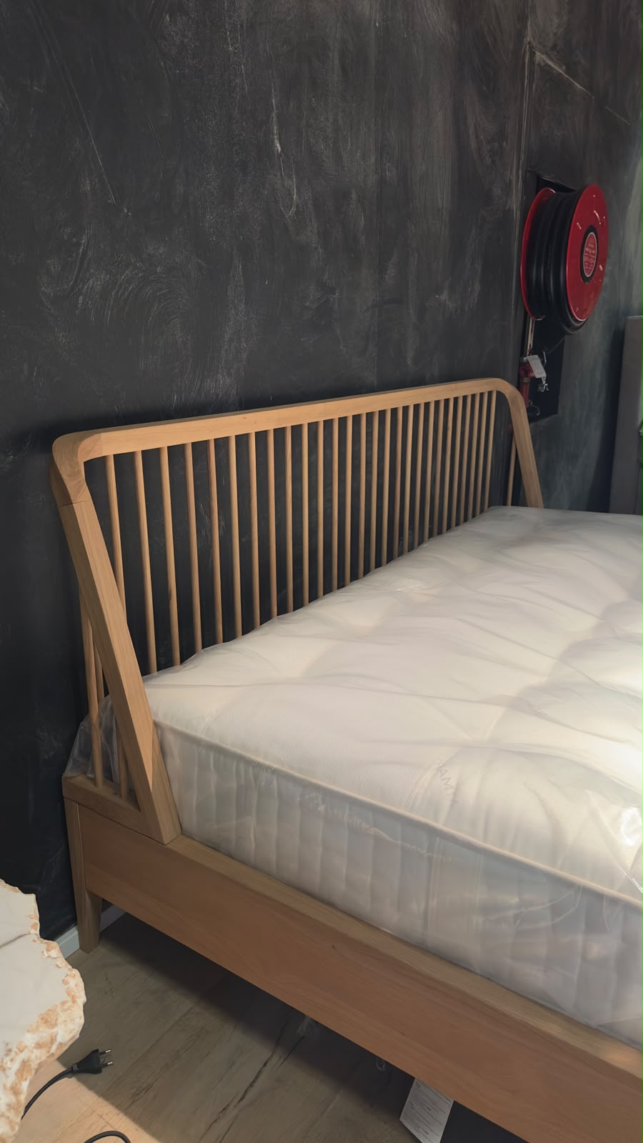 Ethnicraft SPINDLE Bed made of oak with a distinctive spoked headboard