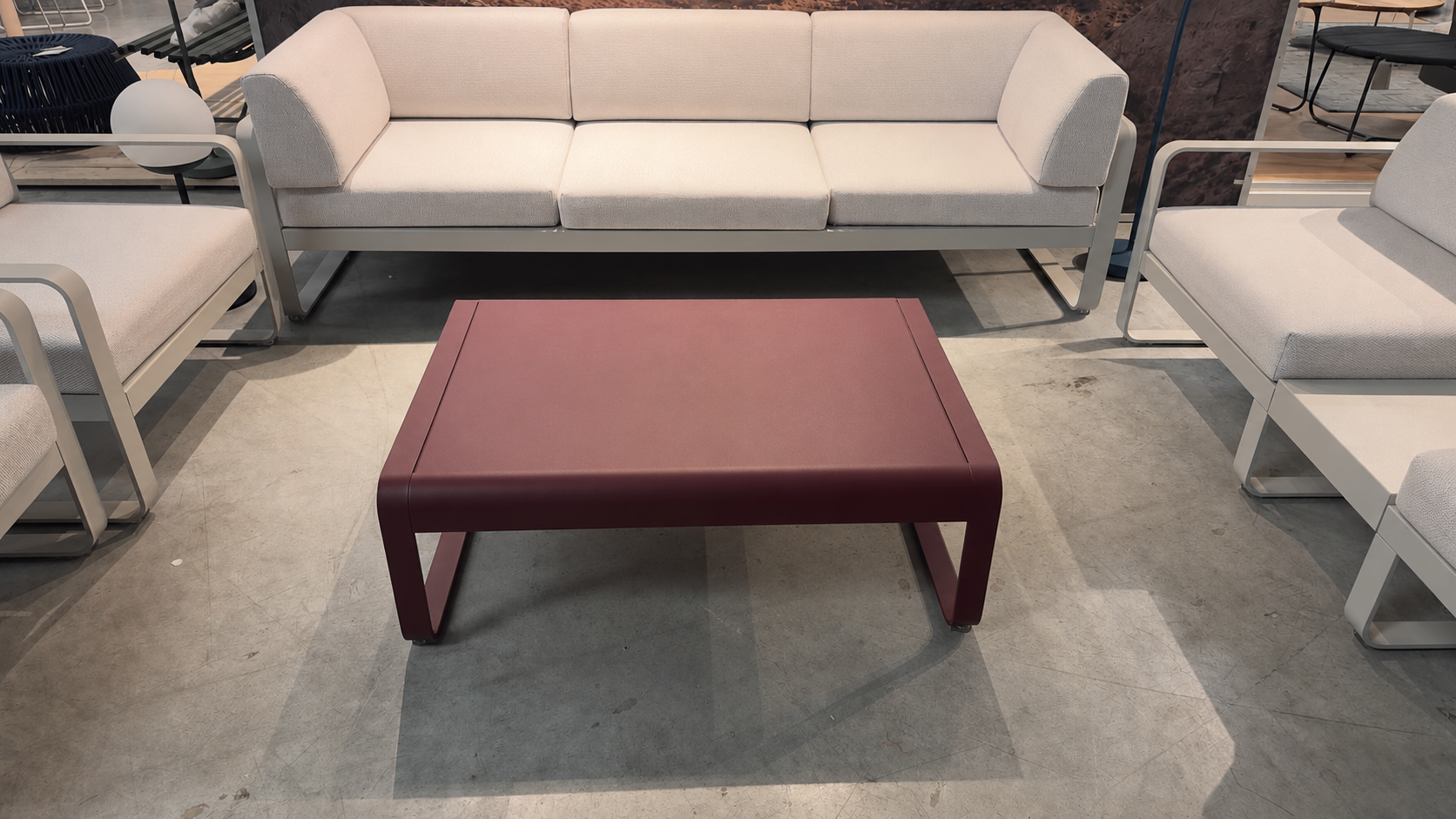 Fermob BELLEVIE aluminum coffee table in Cerise Noire with a U-shaped base