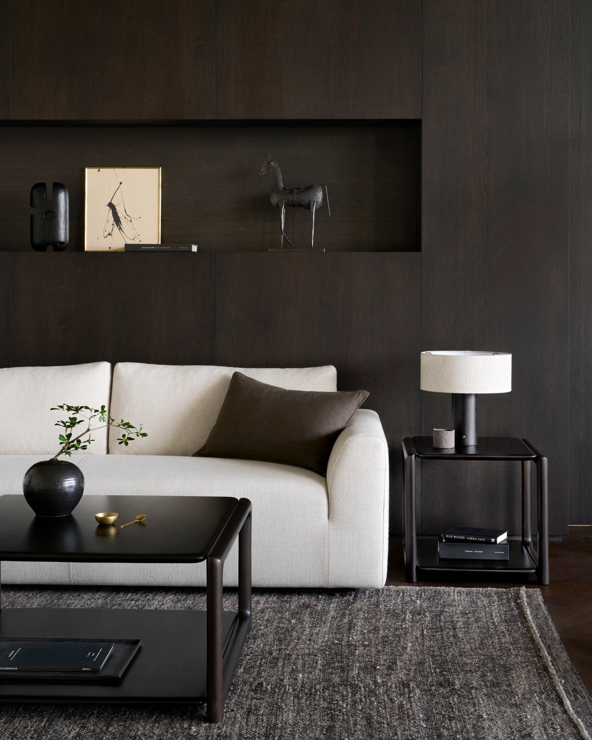 Ethnicraft EDA coffee table in Rose Brown in front of a modern sofa in the living room.