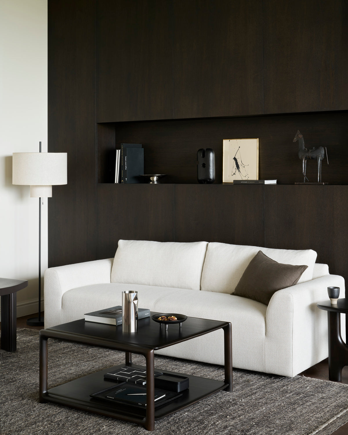 Ethnicraft EDA coffee table in Rose Brown in front of a modern sofa in the living room.