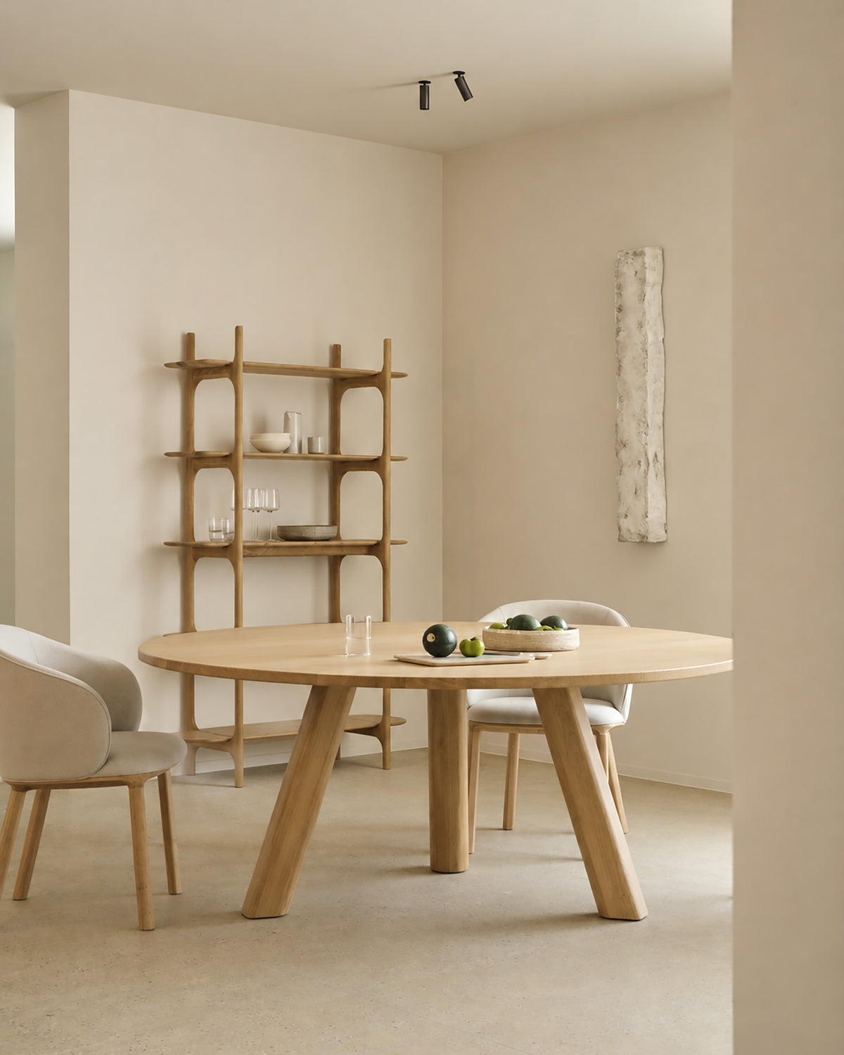 Ethnicraft UNDA dining table with a round tabletop and a diameter of 180 cm in a spacious living and dining area.