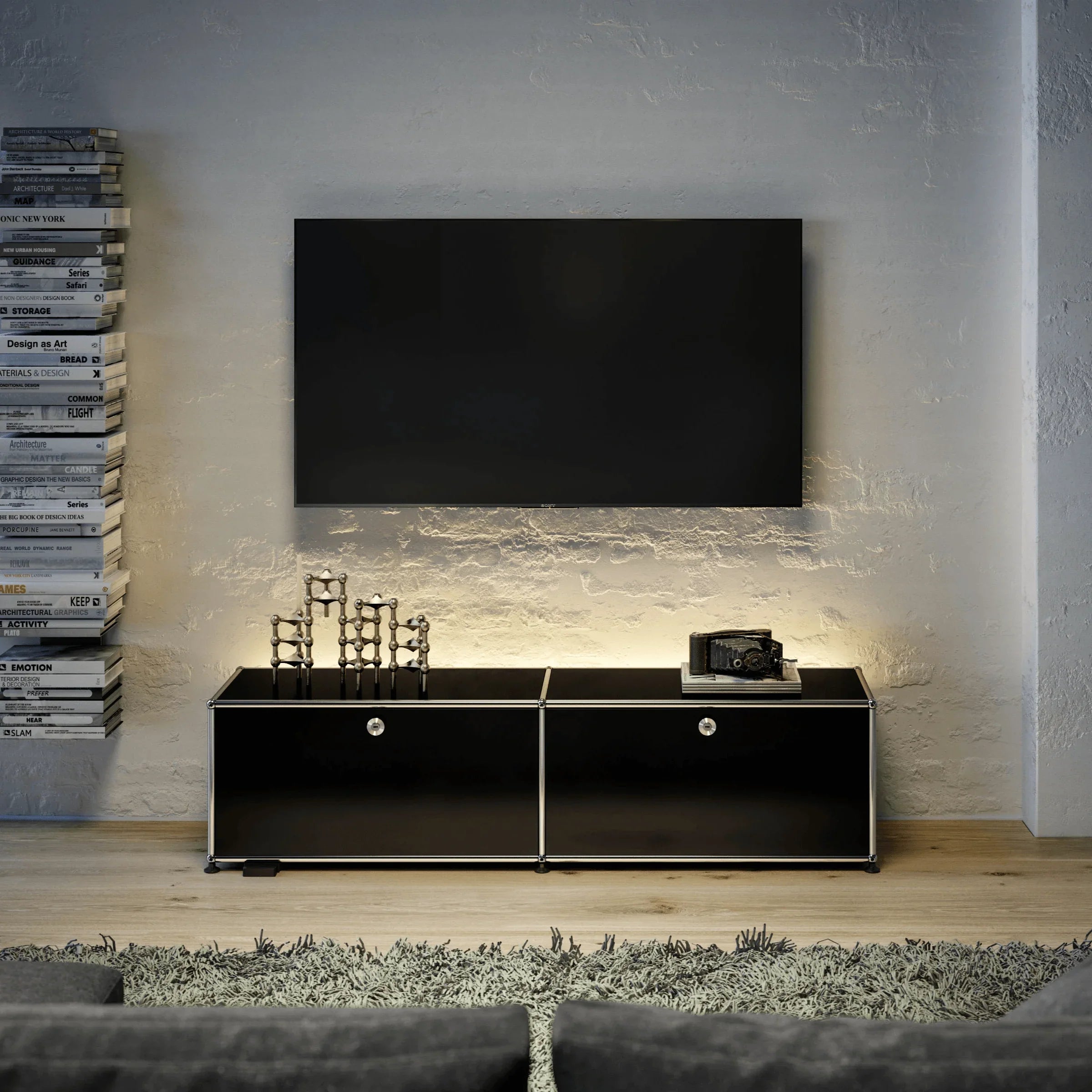 USM Haller Lowboard M59 in Graphitschwarz – stilvolle Beispieleinrichtung als TV-Möbel im Wohnzimmer mit klarer Linienführung, viel Stauraum und modernem Systemdesign