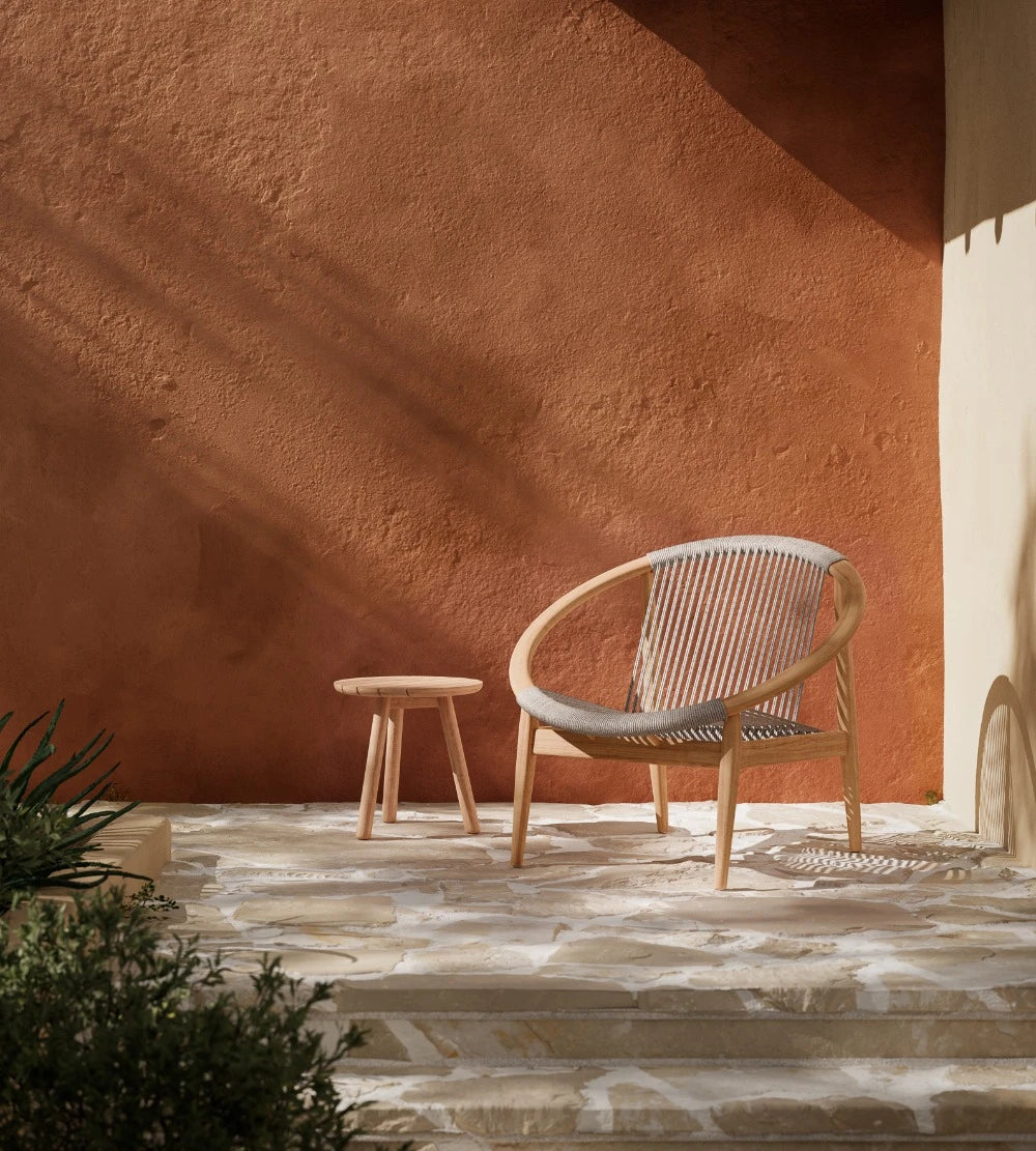 Vincent Sheppard FRIDA garden armchair with an open silhouette for the outdoor lounge area, in the color Dune White.