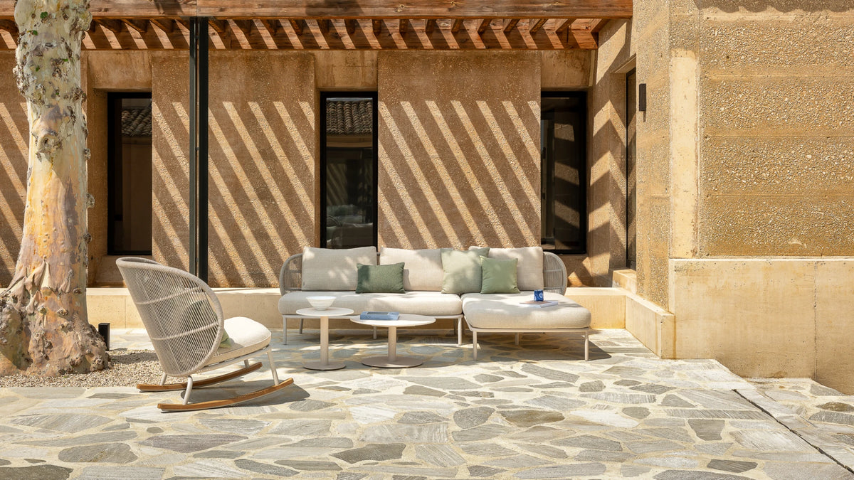 Vincent Sheppard KODO Rocking Chair with Pillow in the Outdoor Lounge Area