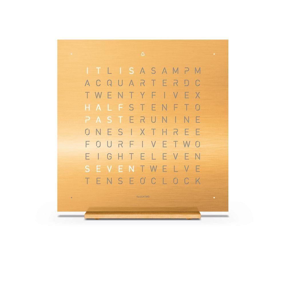 QLOCKTWO EARTH 13.5 Golden Legend – front view of the luxurious gold stainless steel table clock with typographic time display