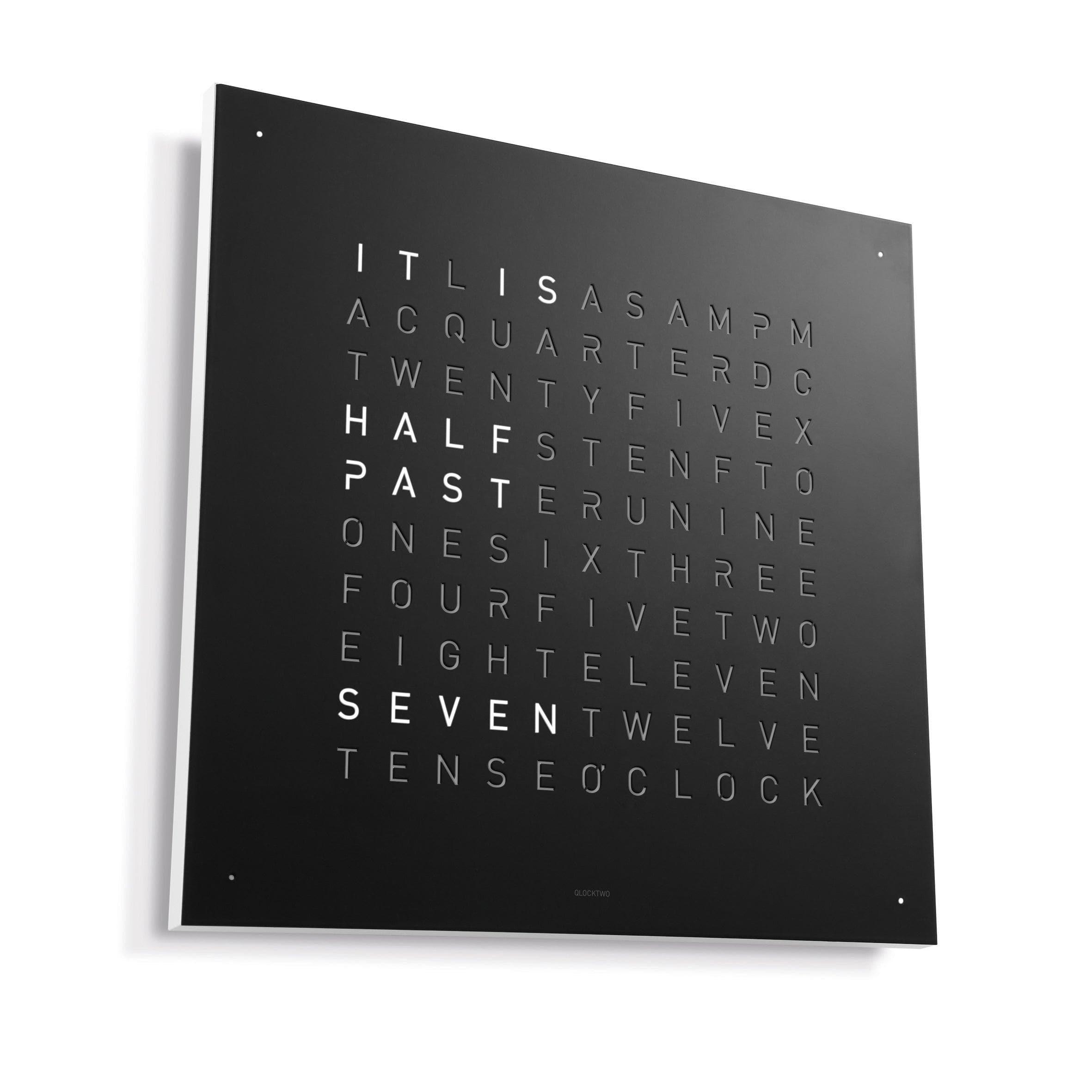QLOCKTWO EARTH 90 with white frame – high-impact black steel meets minimalist white for stunning contrast